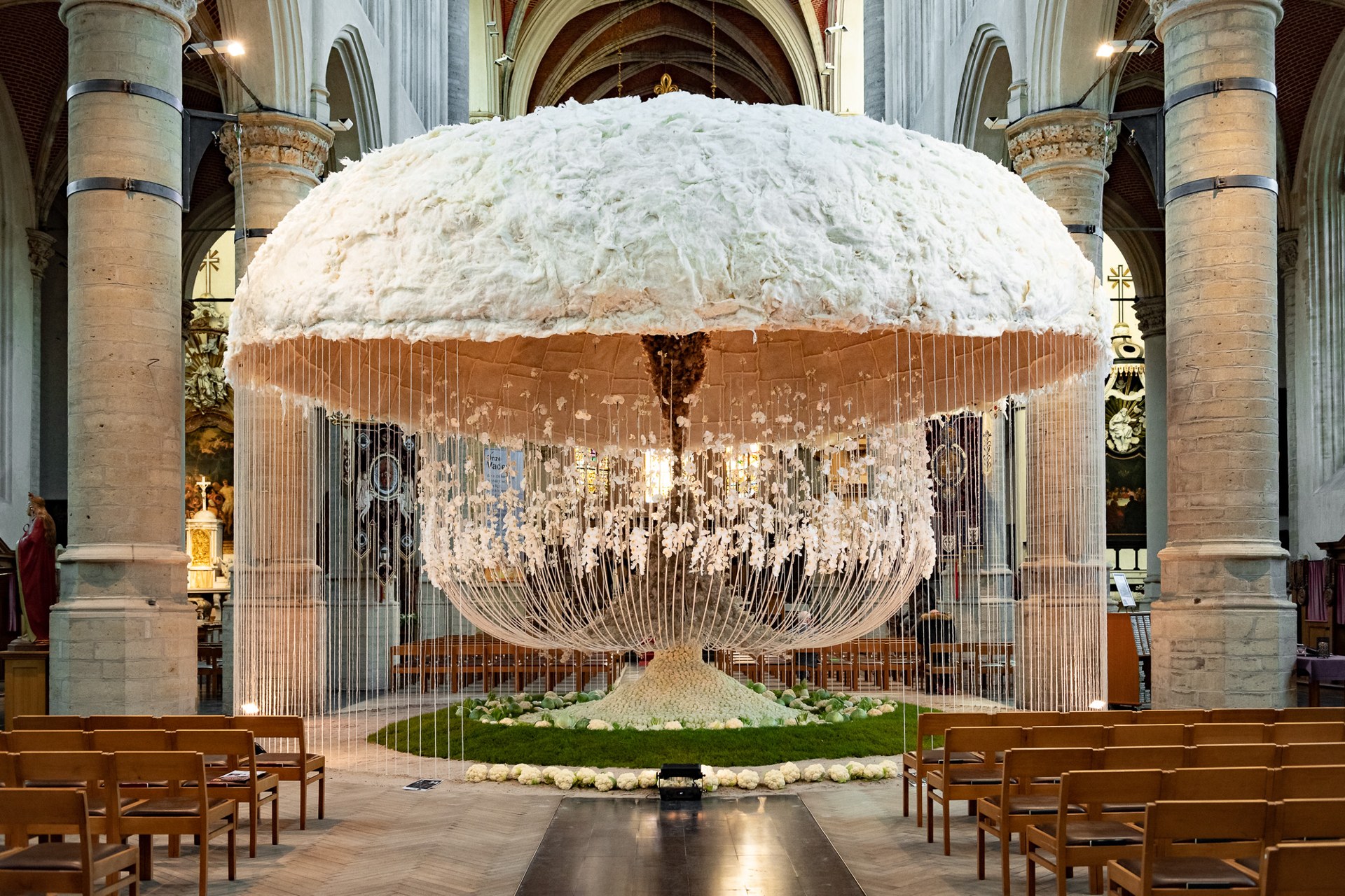 Suspended floral installation in a white baroque hall